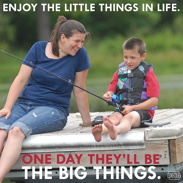 a mother and son fishing from a dock.